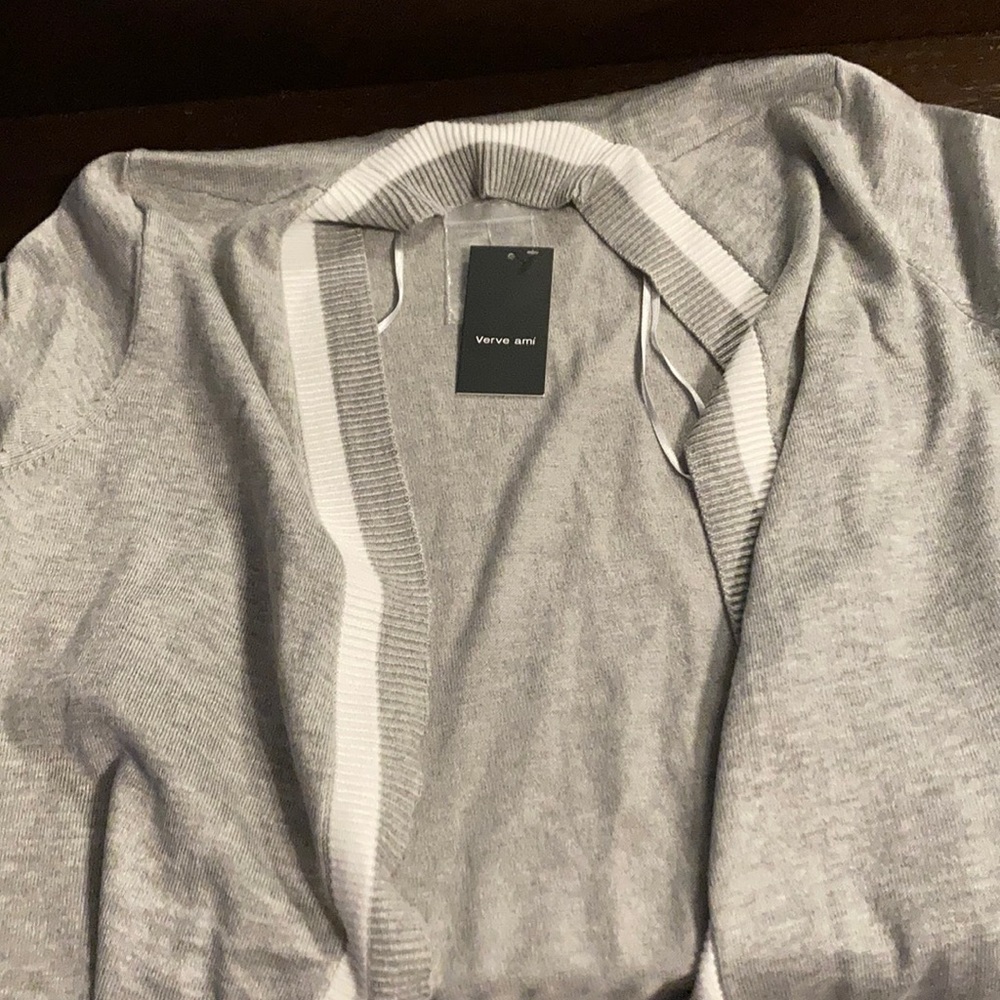 Grey jacket, very thin. I